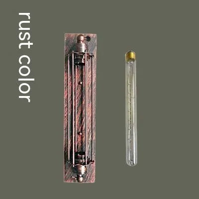 Industrial retro iron wall lamp in antique bronze finish showing flute design.