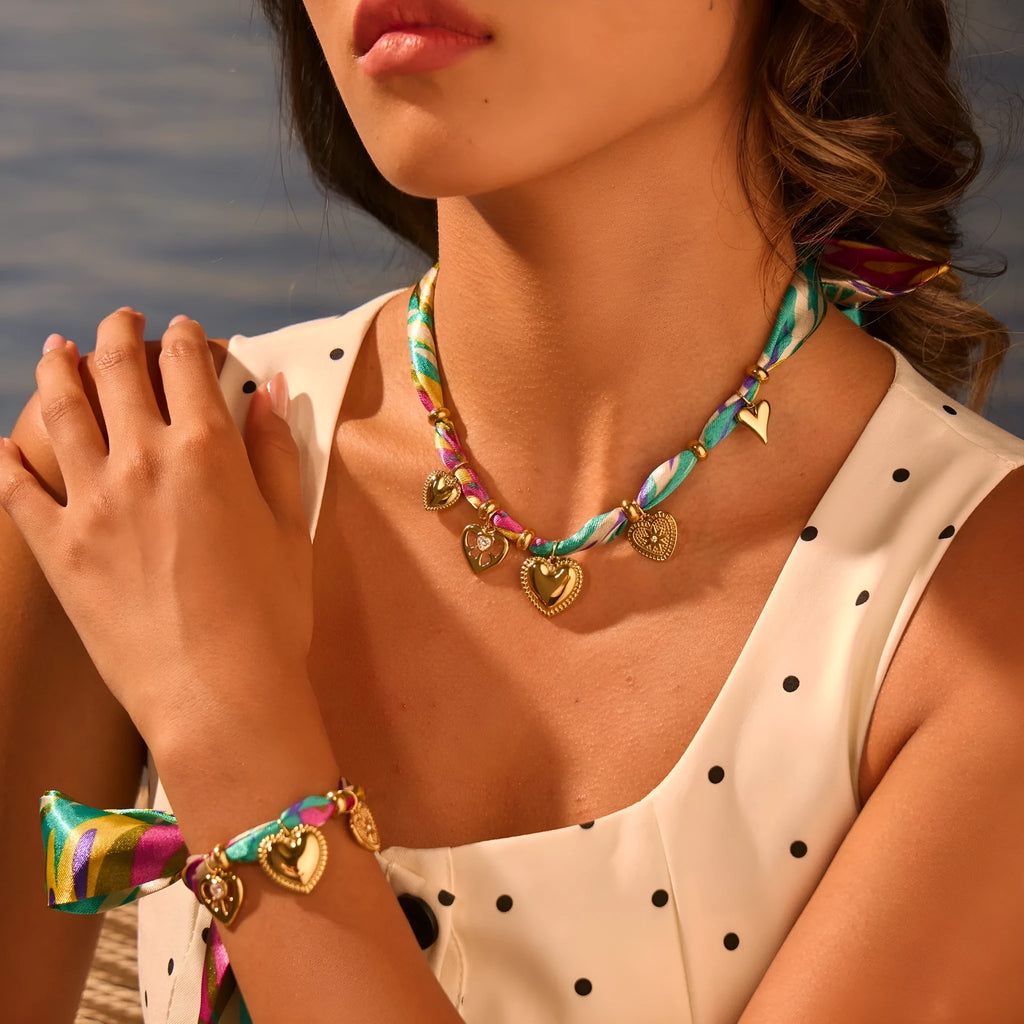 Women's stainless steel necklace and bracelet set with 18K gold plating and geometric pendant