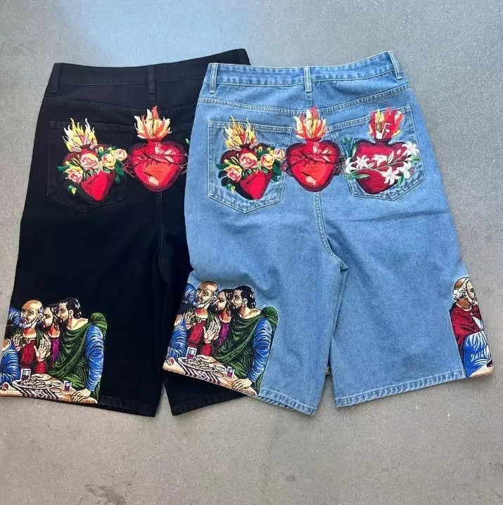 Blue men's cotton shorts with a Jesus design printed on the back pocket, showing tapered leg fit.
