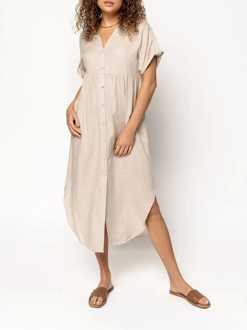 Loose mid-length casual dress with button front in solid colour, shown in apricot