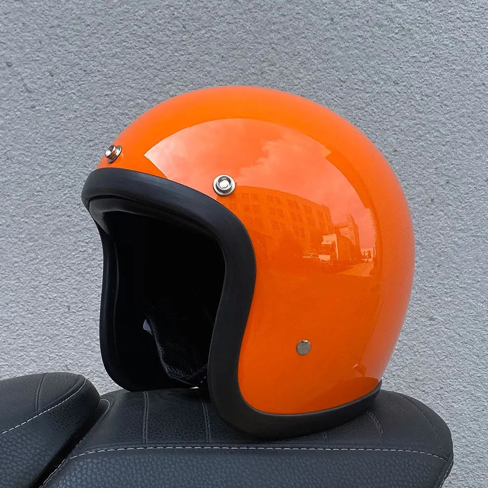 Retro-style half helmet for motorcycles with a fibreglass shell shown in a cement grey colour.