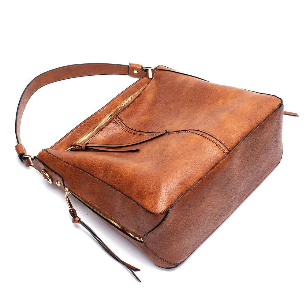 Large capacity PU hobo bag for women with zip closure, internal pockets, and soft handles in solid colour