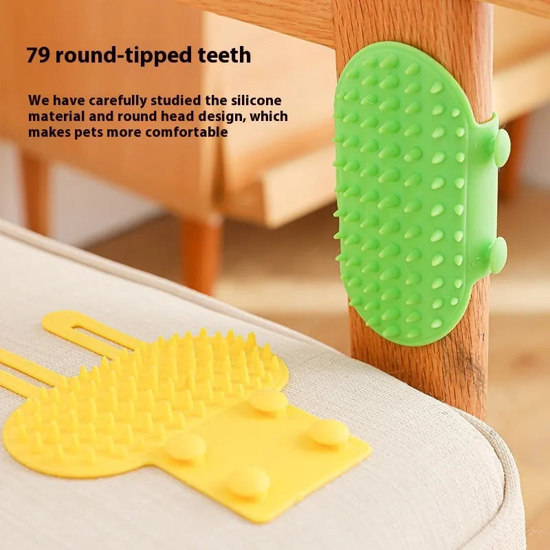 Silicone cat grooming comb with adjustable strap mounted on a table leg, shown in green colour.
