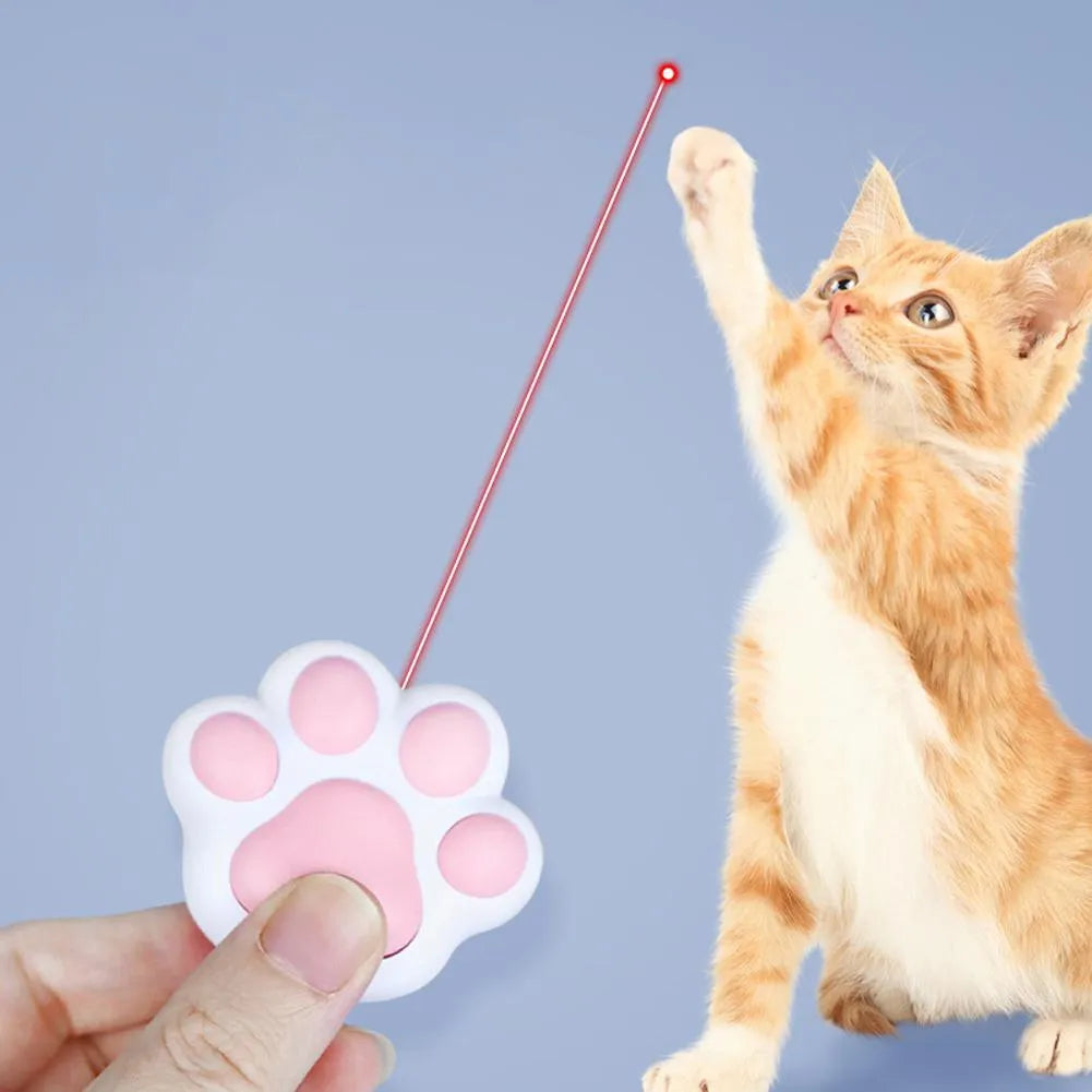 Pink and black USB-rechargeable infrared laser cat teaser toy with keychain loop.