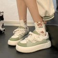 Green women's casual shoes with round toe and flat heel, made from breathable PU mesh.