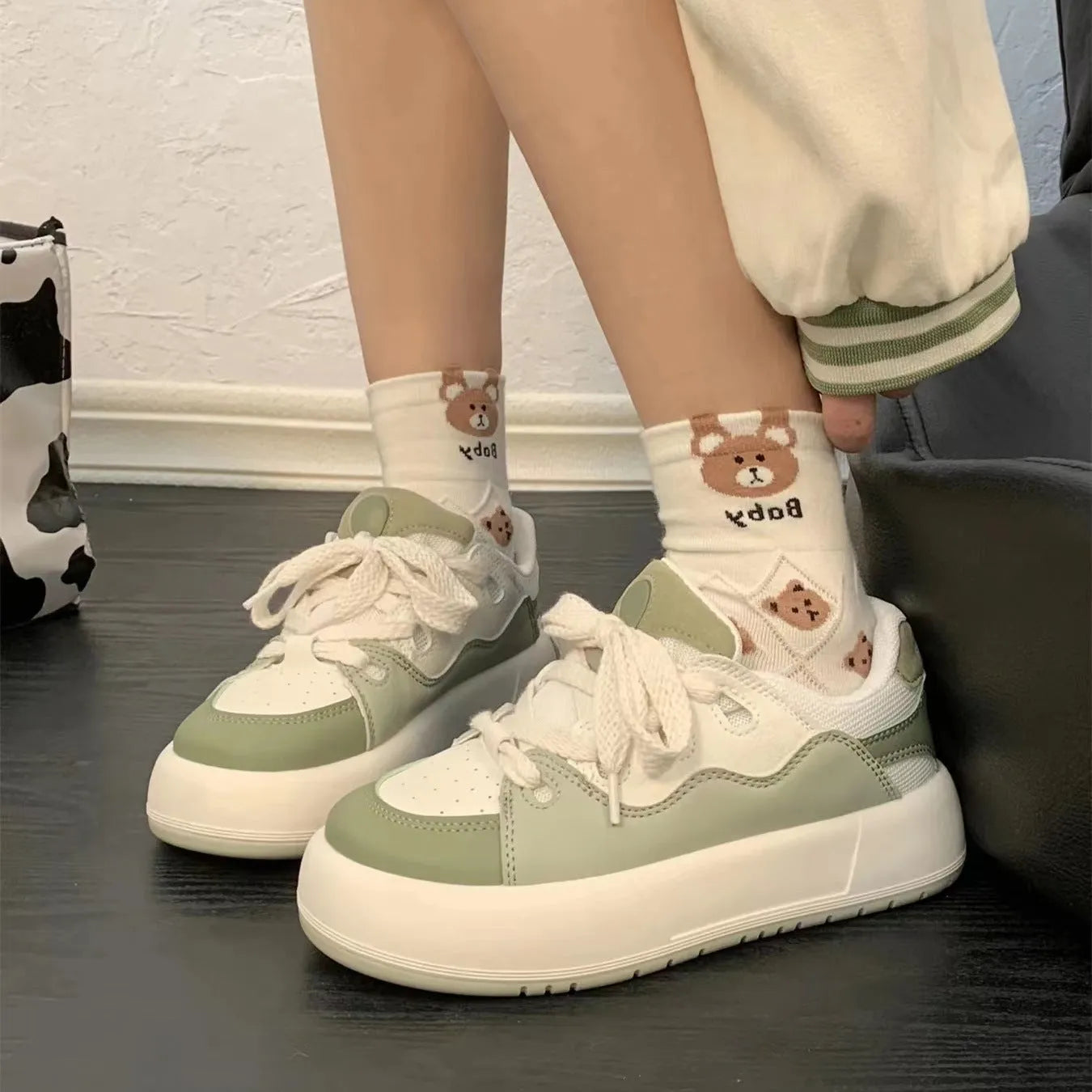 Green women's casual shoes with round toe and flat heel, made from breathable PU mesh.