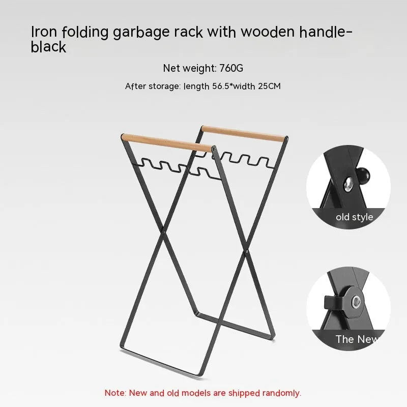Black folding outdoor trash rack with a wooden handle, holding a rubbish sack.