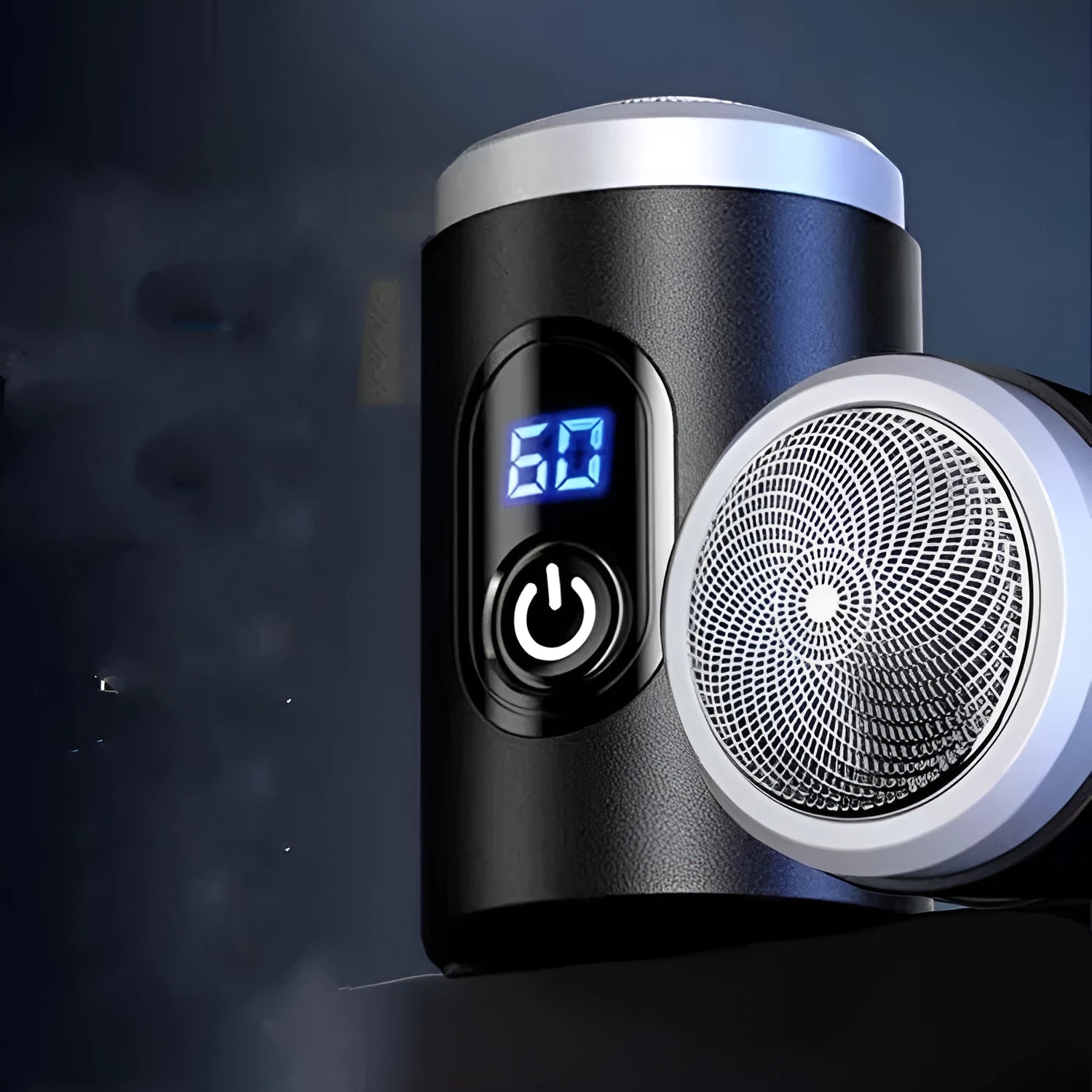 Black mini rechargeable shaver with USB cable and cleaning brush on a table
