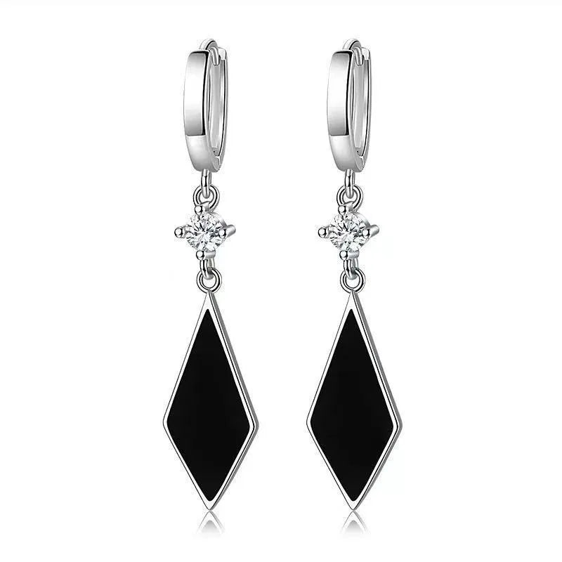 A pair of silver-coloured vintage geometric diamond earrings with an ear clip fastening.