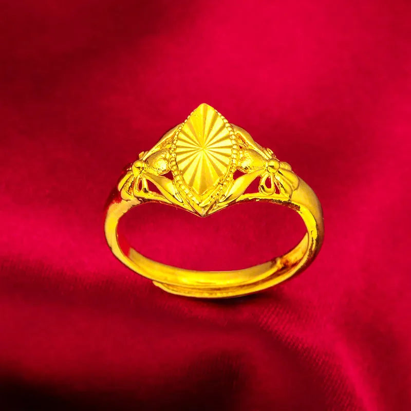 Alluvial gold tone open diamond flower ring with geometric design and textured surface