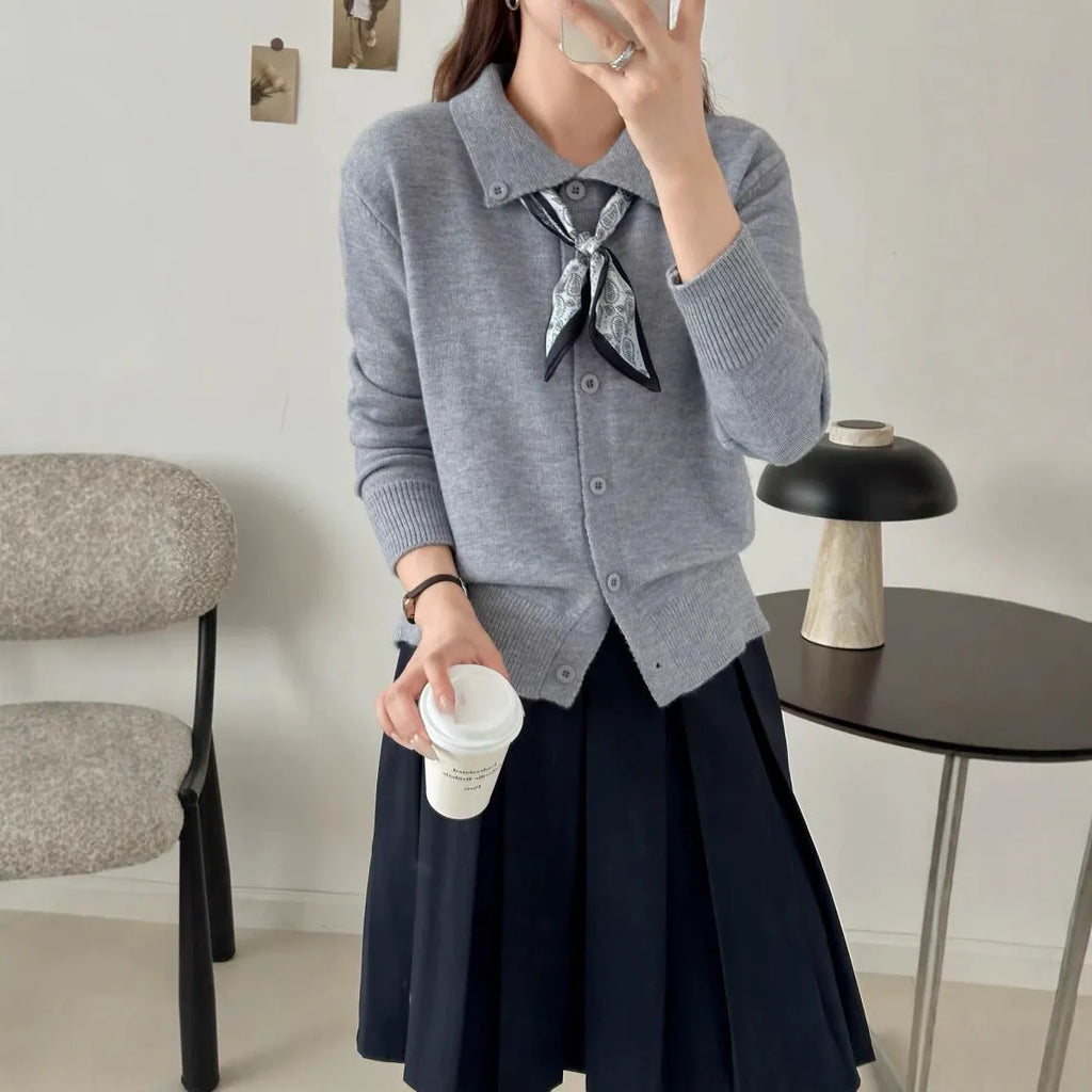 Beige lapel scarf cardigan sweater with long sleeves and splicing details on a model.