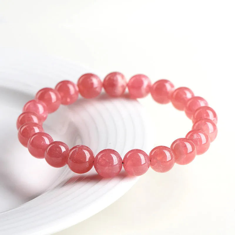 Natural red rhodochrosite crystal bracelet with geometric beads and longevity lock closure