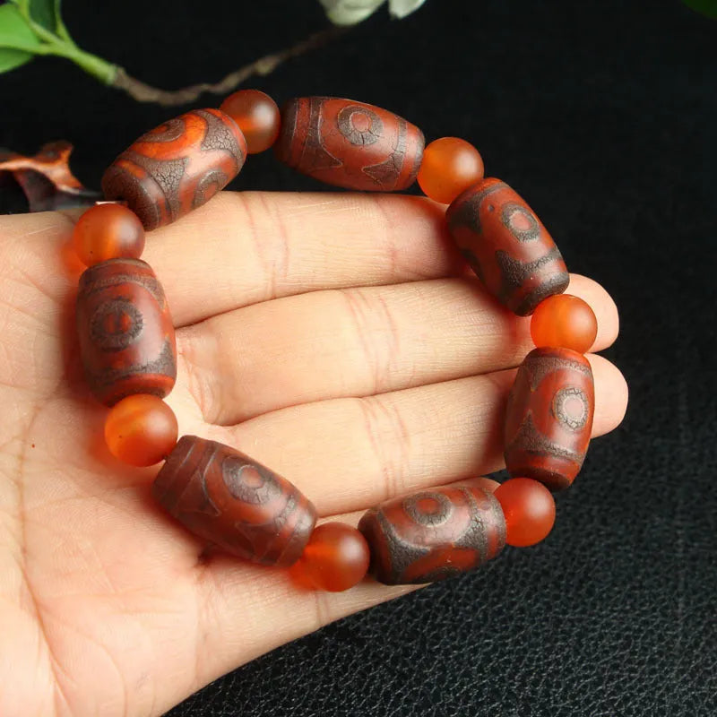 Agate Tibetan dzi bead bracelet with three-eye design and polished finish