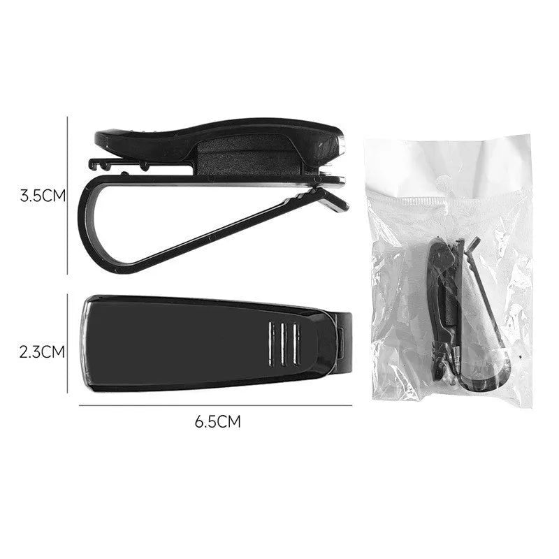 Black plastic multifunctional clip for mounting on a car sunshade to hold glasses, tickets, and ID cards.