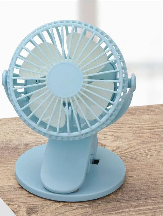White USB rechargeable brushless clip fan attached to a desk edge