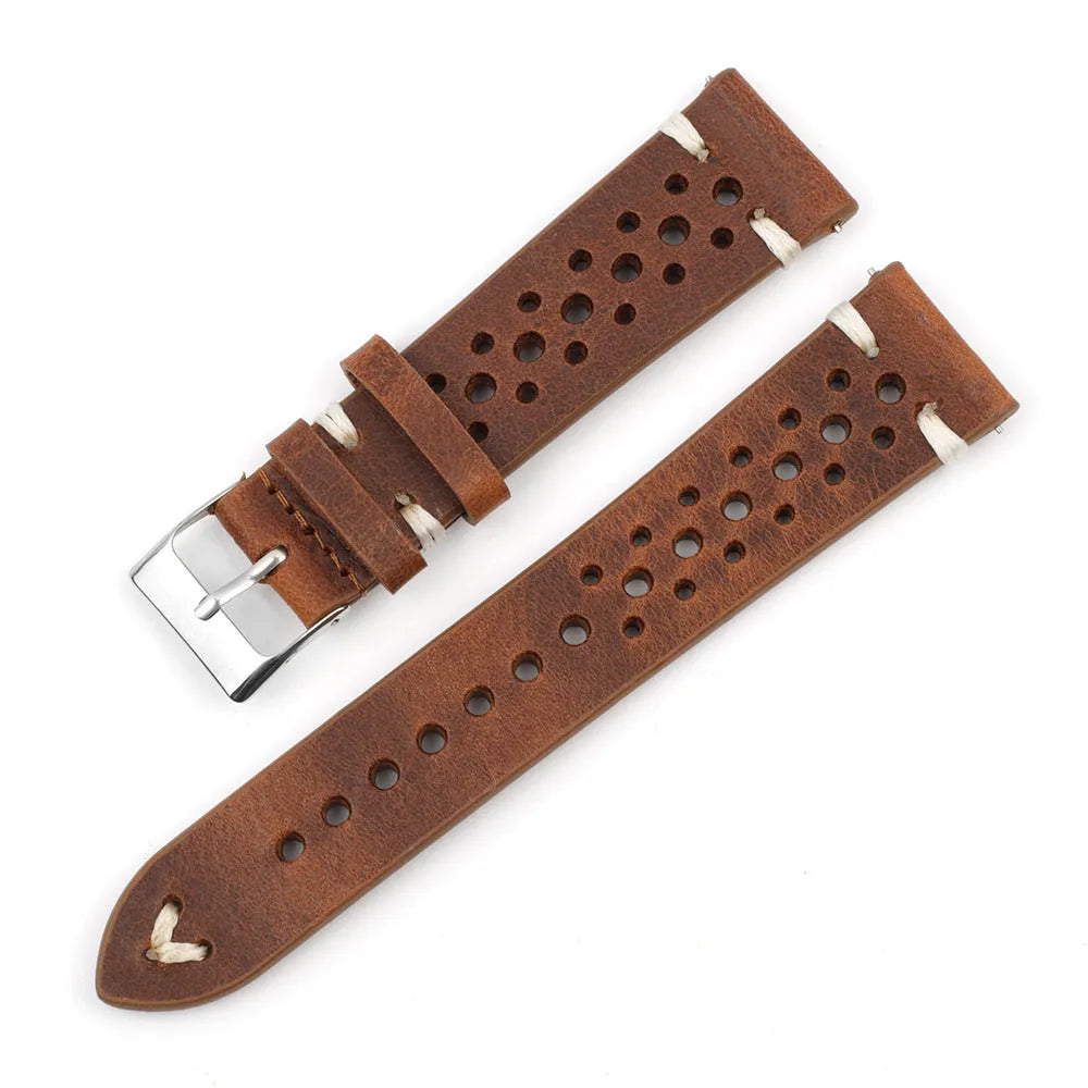 Handmade retro genuine leather watch band in brown with white stitching on a wooden surface