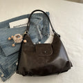 Large capacity PU leather commuter backpack with single shoulder strap in horizontal square design