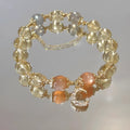 Chinese style crystal bracelet with 14K electroplated gilding and diamond-shaped citrine moon coloured elements