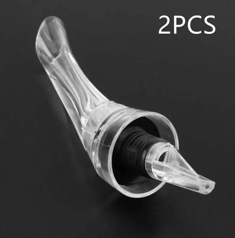 Compact transparent wine aerator with stainless steel filter measuring 16 by 4.2 centimetres