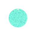 Round silicone pet licking mat with suction cup base in blue colour on a floor.