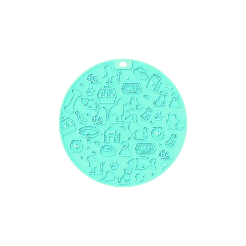Round silicone pet licking mat with suction cup base in blue colour on a floor.