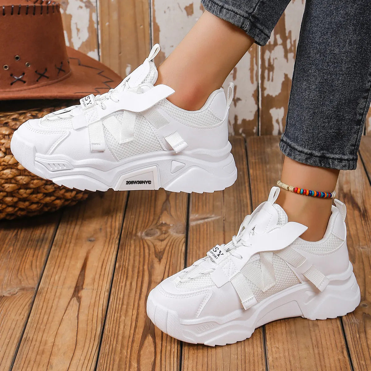Women's purple platform mesh sports sneakers with animal pattern and lace-up front.