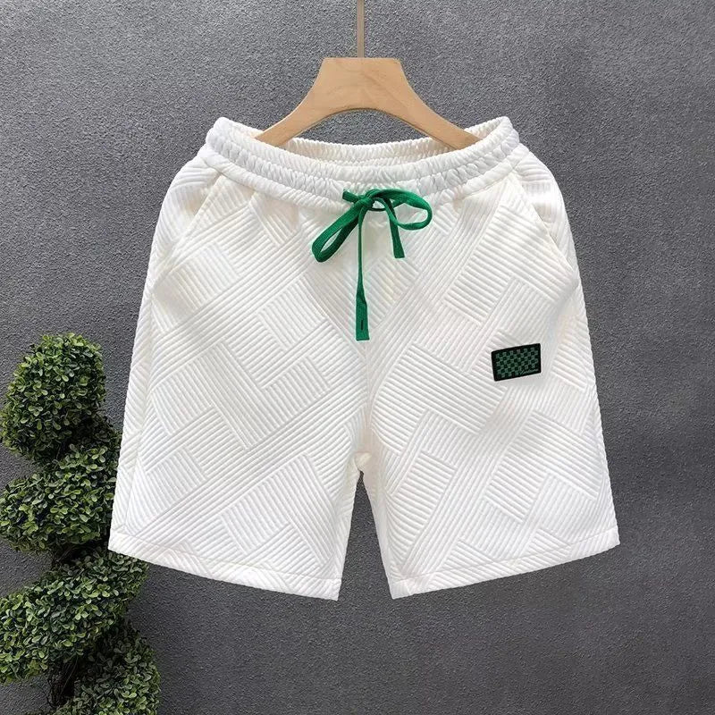 Men's casual polyester sports shorts in solid colours with micro-elastic fabric for beach and sports activities