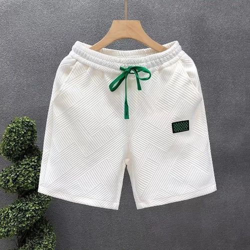 Men's casual polyester sports shorts in solid colours with micro-elastic fabric for beach and sports activities