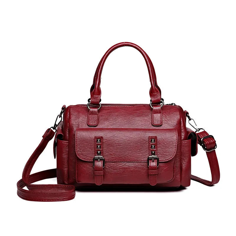Vintage messenger bag in horizontal square shape showing contrast stitching details and shoulder strap