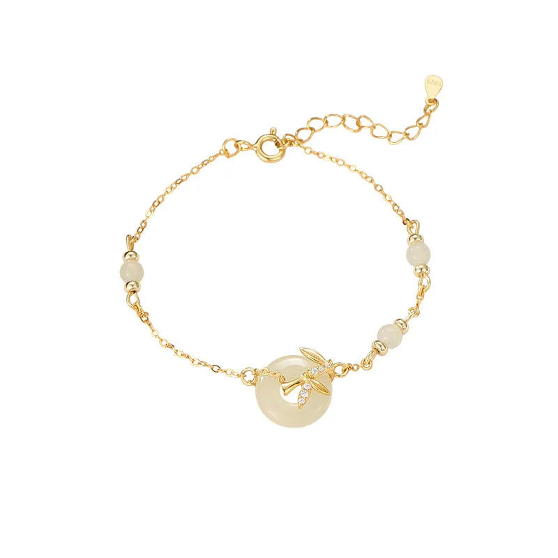 Women's antique-style silver bracelet with a peace symbol safety buckle clasp, shown in gold and silver finishes.