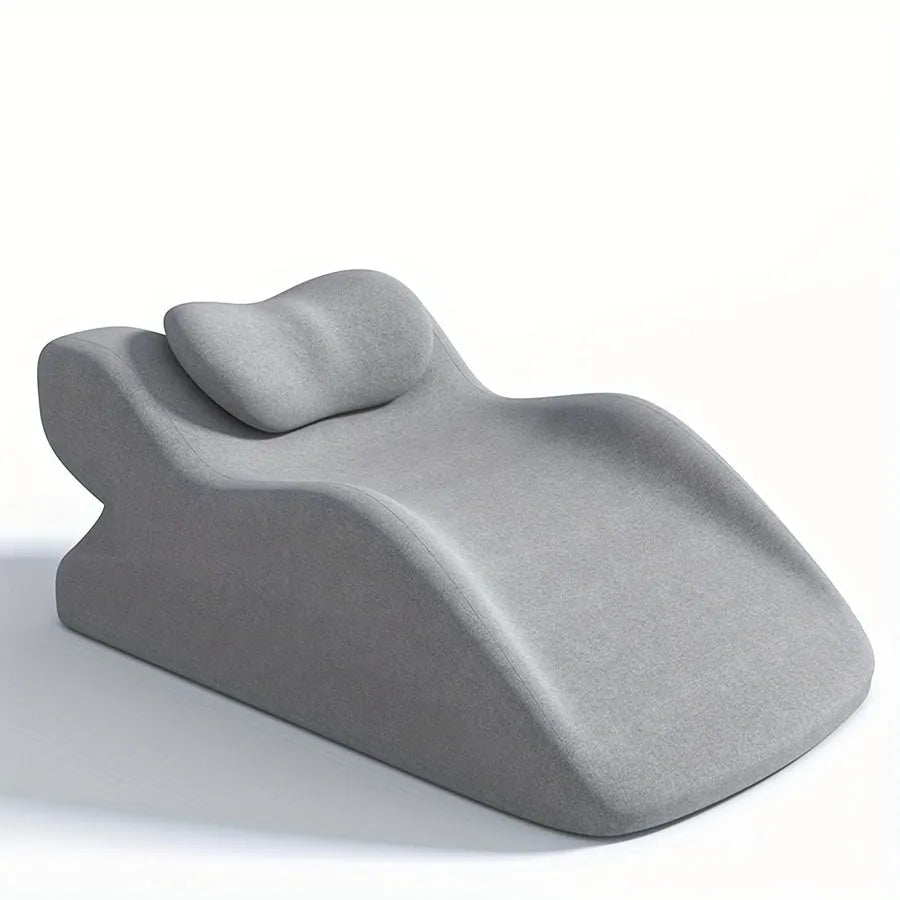Ergonomic stomach sleeper pillow for reading in bed, shown in blue colour
