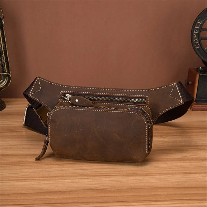 Brown cow leather sports waist bag with pull closure showing internal mobile phone pocket