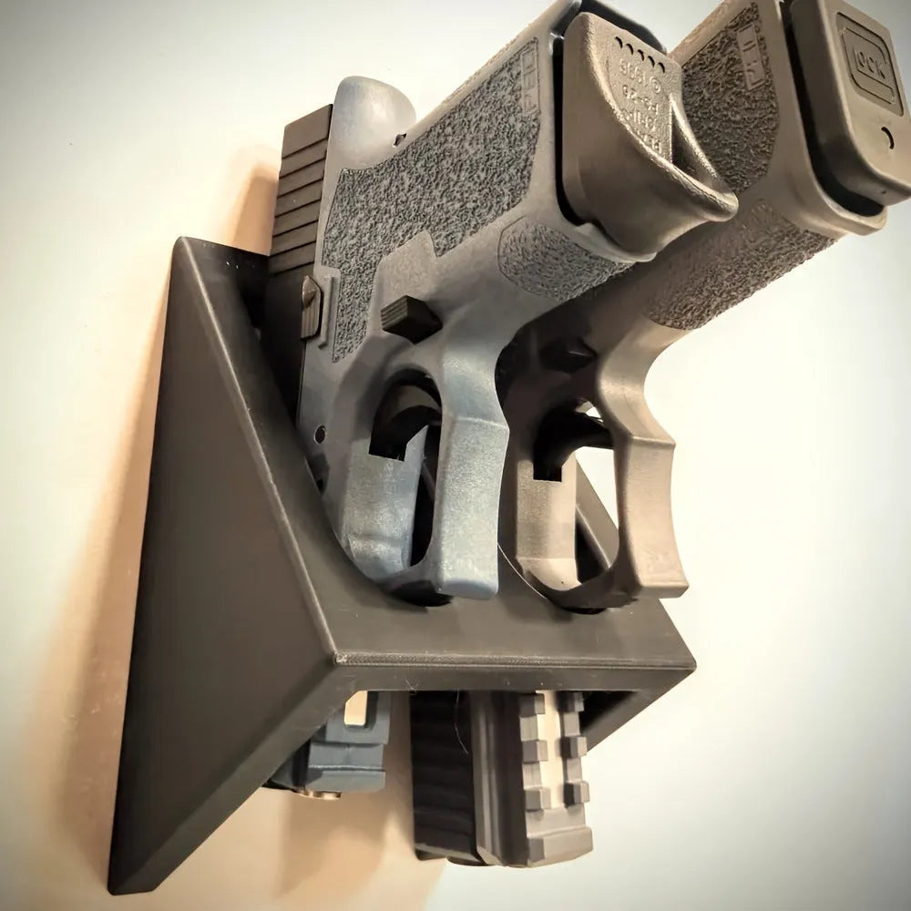 Black punk-style plastic pistol stand for airsoft gun display