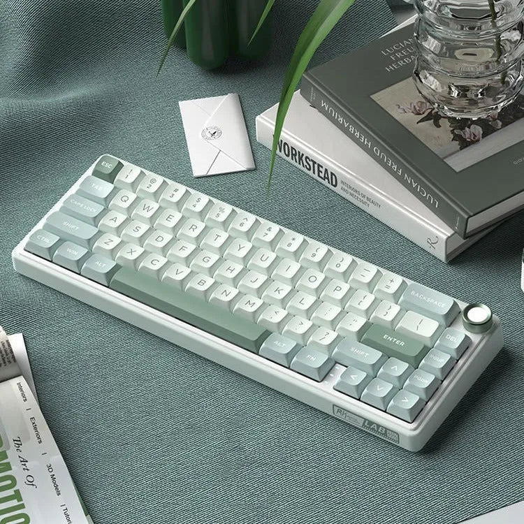 White wireless mechanical keyboard with RGB backlit keys on a desk.
