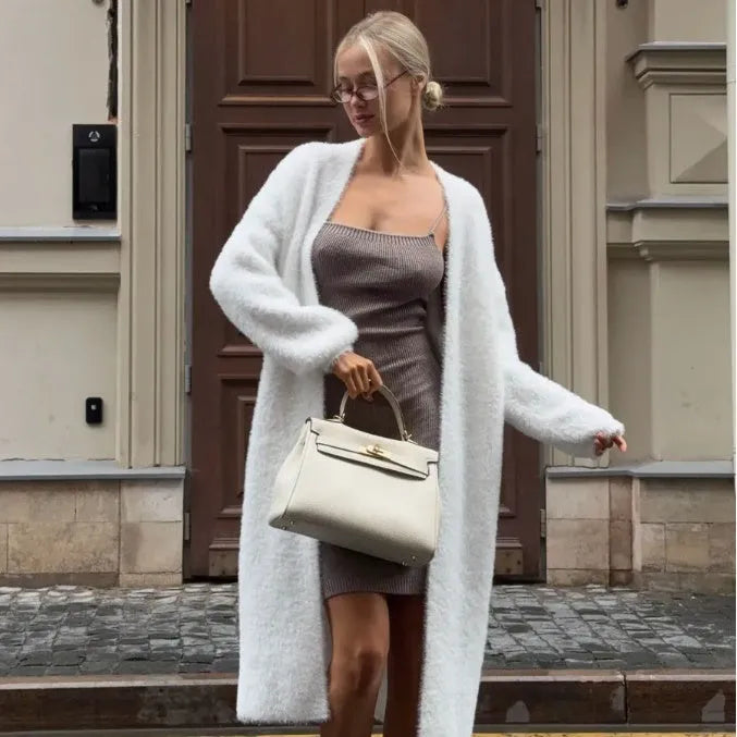 White women's longline cardigan jacket with long sleeves, loose fit.