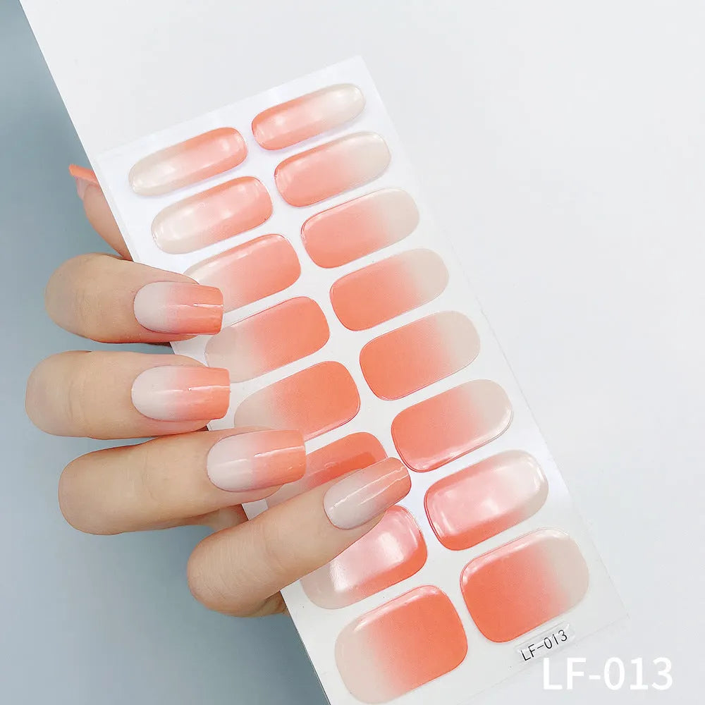 Full nail art sticker sheet showing 16 different solid colour designs including European simple nails and floral patterns