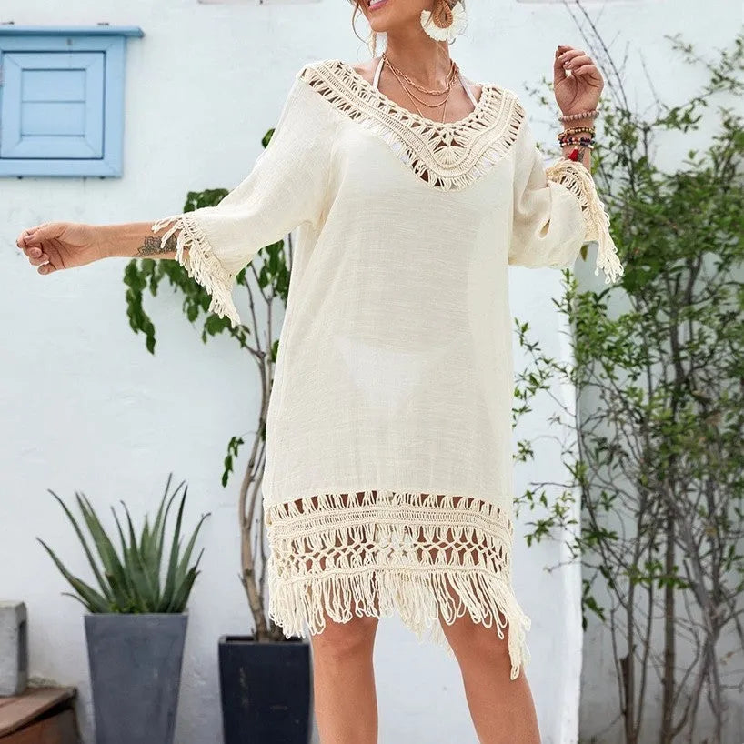 Apricot coloured women's crochet patchwork midi dress with half sleeves on a hanger.
