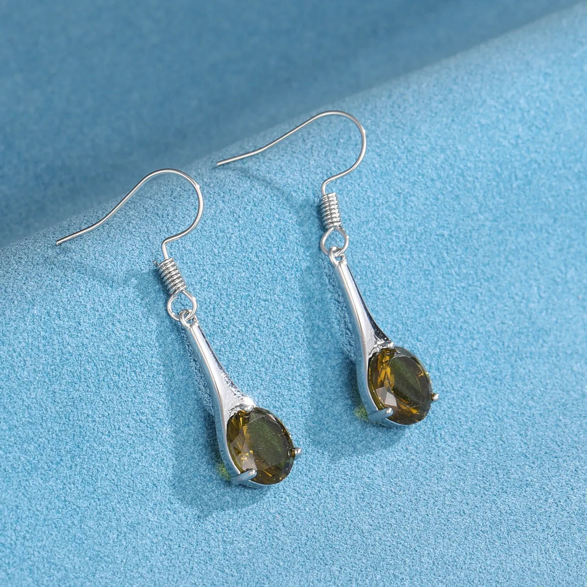 Olive green topaz water drop shaped earrings with retro design and electroplated alloy construction