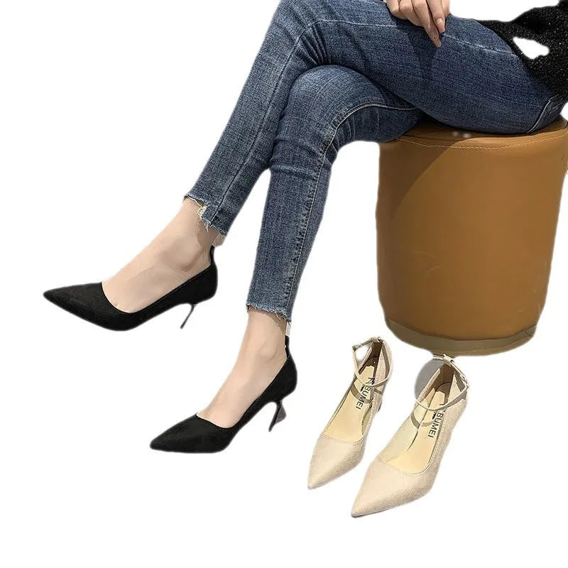 Women's black stiletto pump with buckle closure on 8cm heel