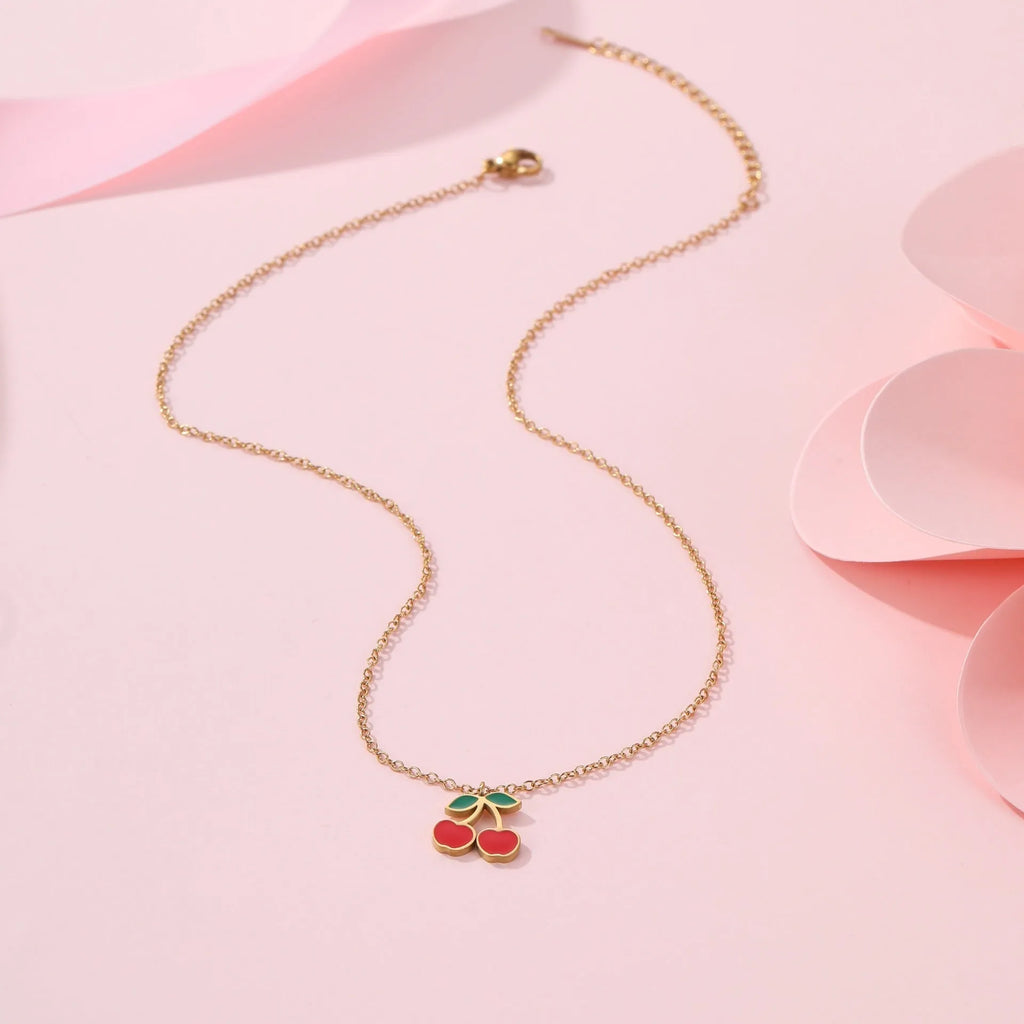 Cherry shaped jewellery set with necklace, bracelet, earrings, and ring in gold-plated stainless steel