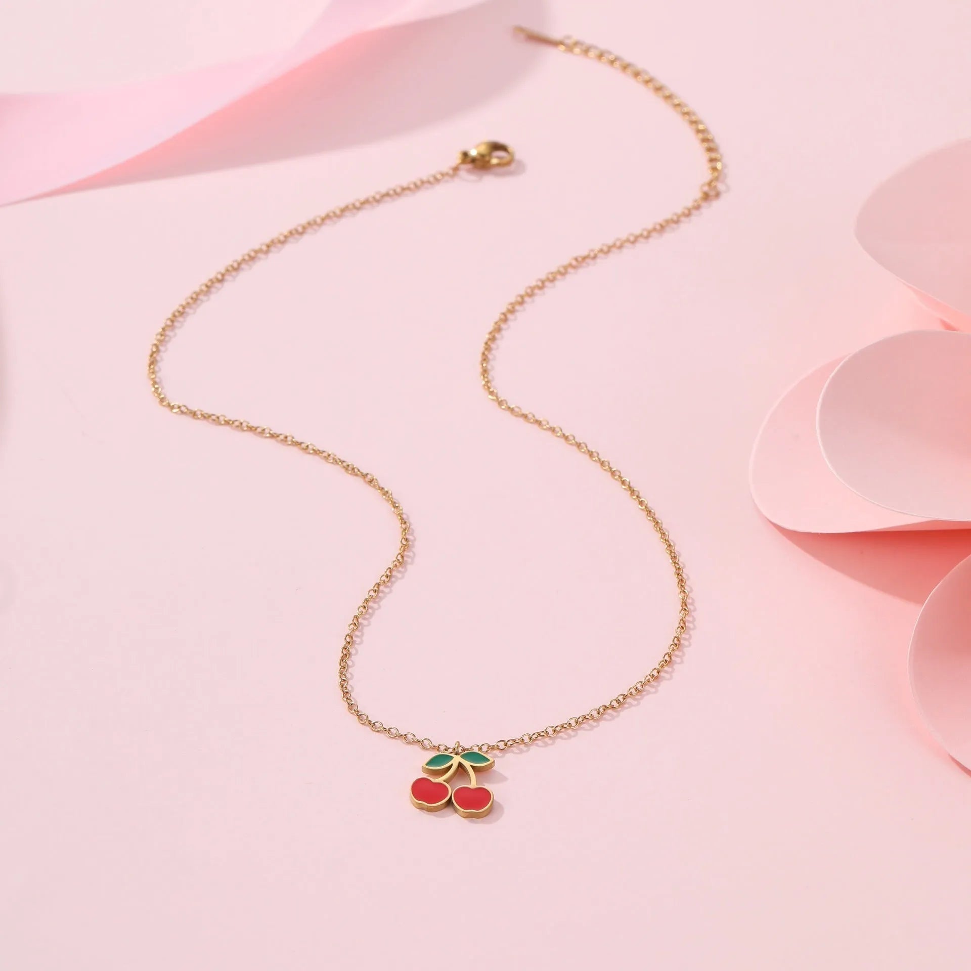 Cherry shaped jewellery set with necklace, bracelet, earrings, and ring in gold-plated stainless steel