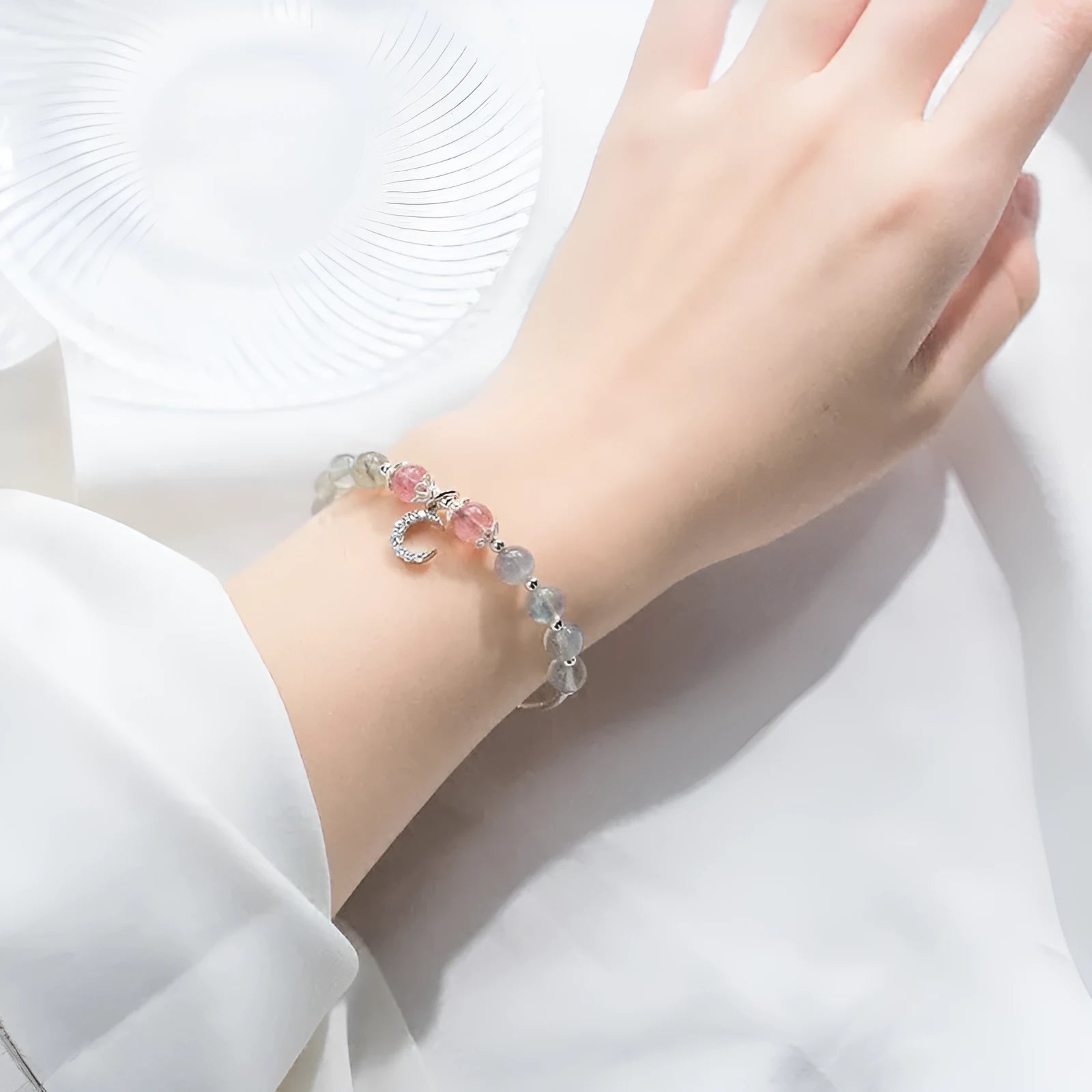 Natural moonstone adjustable bracelet with 6mm gemstone on wrist showing extension chain
