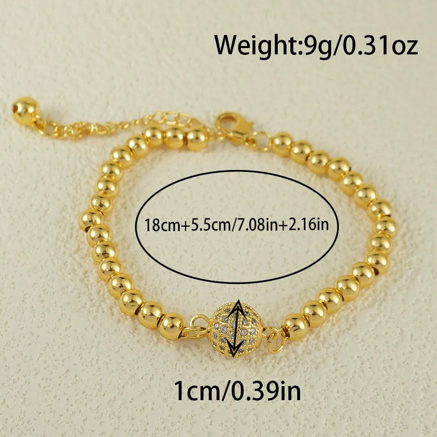 Copper bracelet with heart shape design, zircon accents and Arabic style patterning