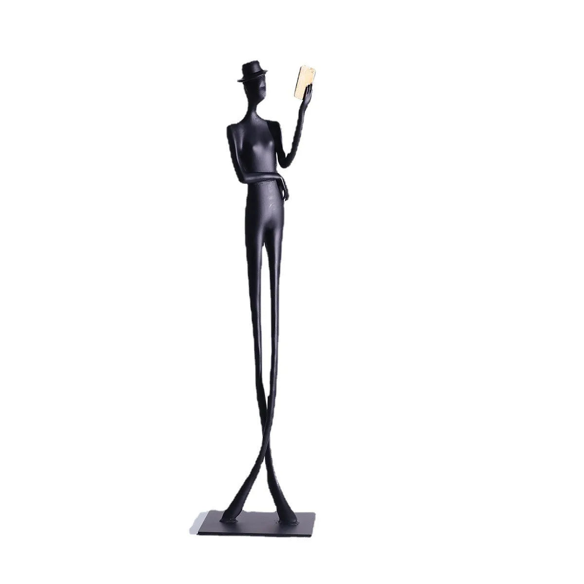 Black aluminium desktop sculpture of a woman reading, modern design.