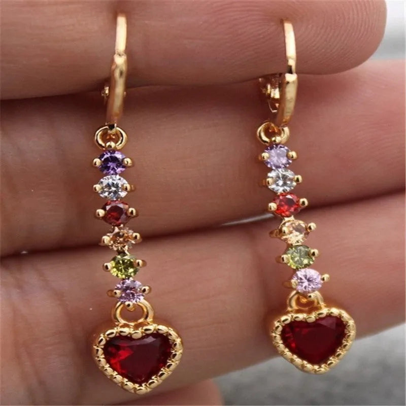 A pair of women's heart-shaped alloy earrings in gold or silver electroplated finish.