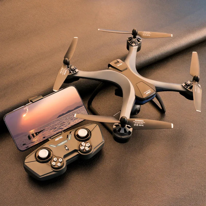 GPS quadrocopter with dual cameras and remote controller showing plastic construction and protective blade covers