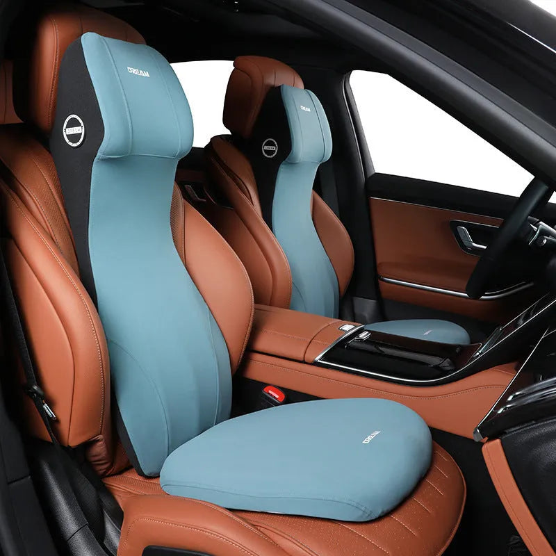 Black automotive memory foam headrest and lumbar cushion combined in one piece on a car seat.