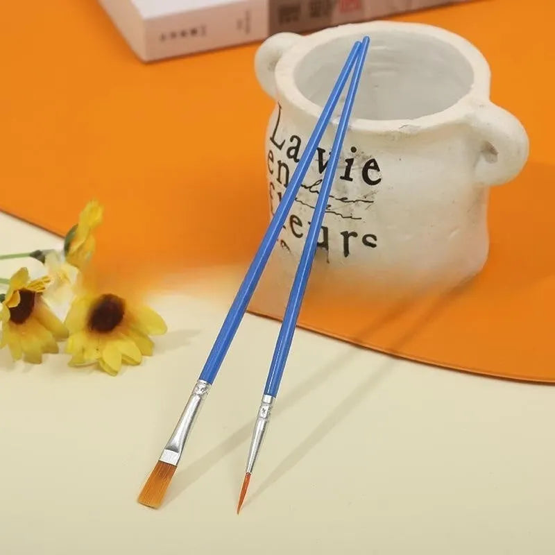 Children's graphic art gouache pen set with flat and hook line pens on a white background