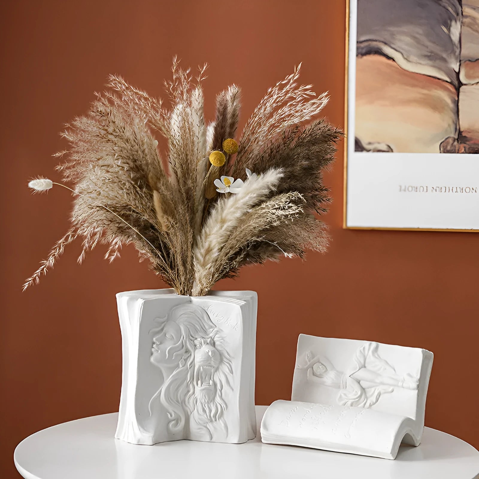 Ceramic book stand with glazed finish in one of four artistic designs on a desk.