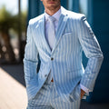 Men's blue solid colour British style double button suit jacket for spring, showing bag cover seam pockets.